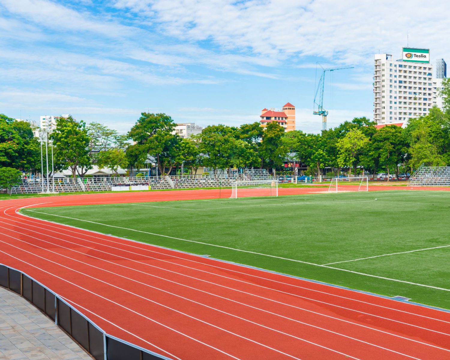 52551545 - running track with soccer field, sport background